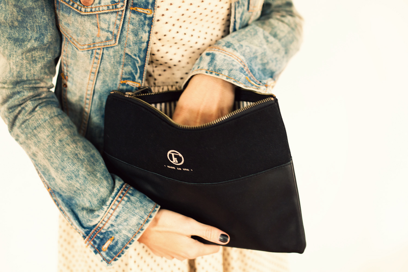 Illustration for article titled A Sturdy Black Clutch That Holds Almost Anything